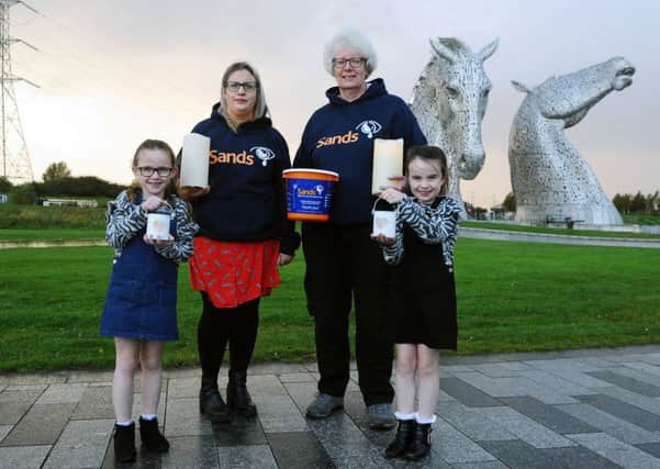 Kellie Cunningham (middle left) with nieces Zara and Elise Anderson and Sands events coordinator Marion Currie. Picture: Michael Gillen