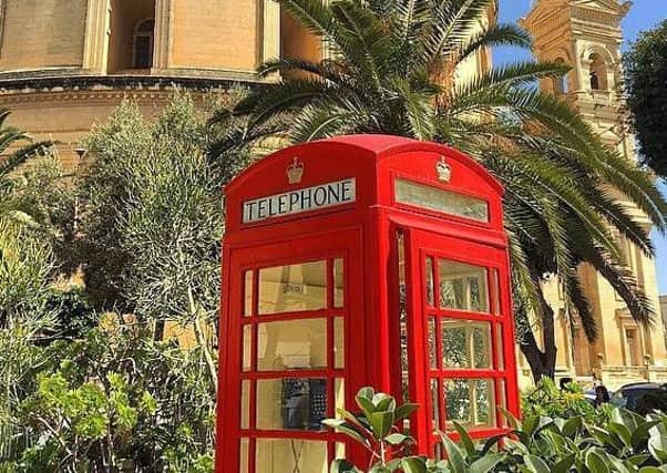 The Carron Telephone Kiosk at Mosta Church, Malta.
