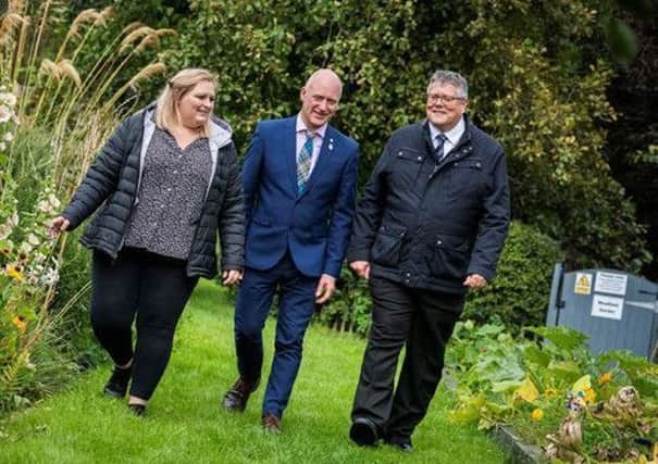 Pictured are, from left, Lara McDonald, member of the National Suicide Prevention Leadership Group; Joe FitzPatrick, Public Health Minister; and Billy Watson, Chief Executive of SAMH.