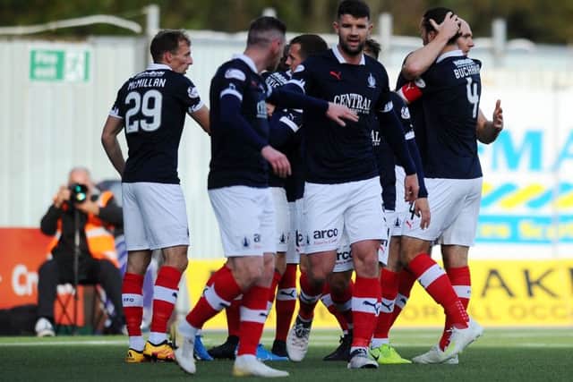 Players celebrate the opening goal