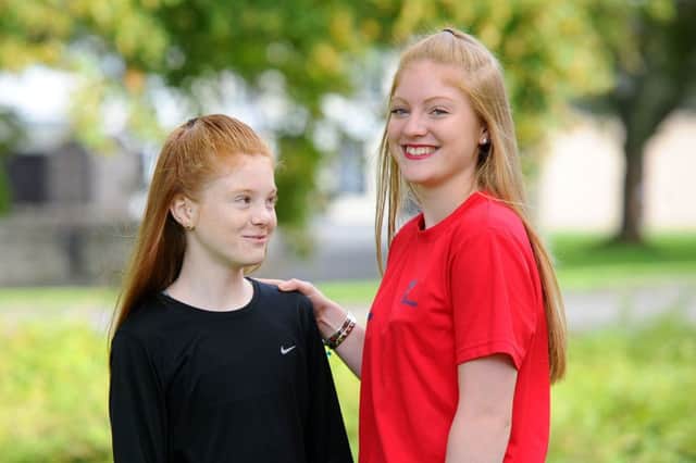 Teigan Smith looks up to big sister Jordyn. Picture: Michael Gillen.