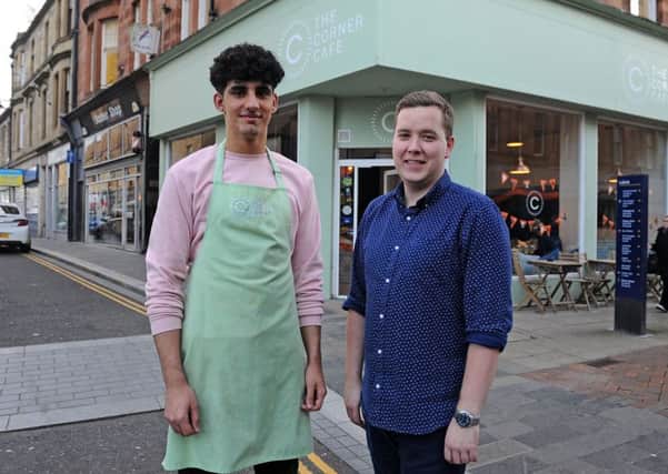 Andrew Harkins (right), owner of The Corner Cafe, is pictured alongside staff member Daniel Ait Tahar. Picture: Michael Gillen