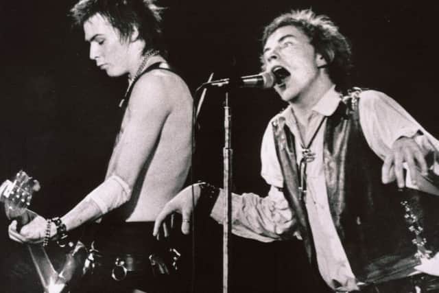 Sid Vicious and Johnny, right, in classic form - at a sell-out performance in California.