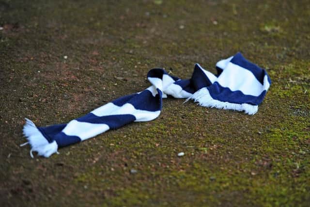 Falkirk scarf was thrown onto the track as the Bairns trudged off at the interval. Picture: Michael Gillen.