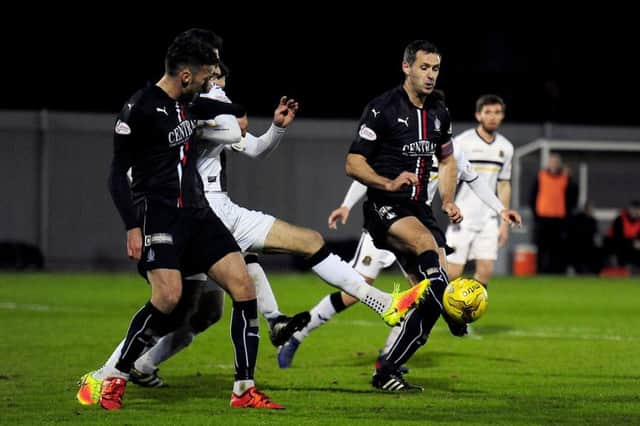 Lee Miller, Gregor Buchanan and David McCracken tussle in a Dumbarton v Falkirk game three years ago. Picture: Michael Gillen.
