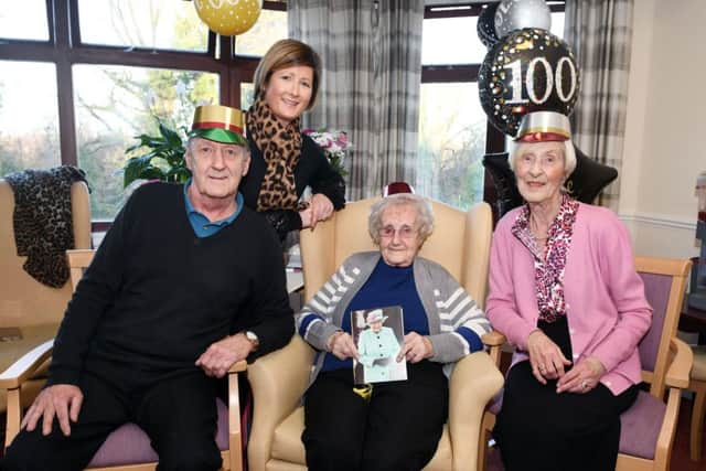 Ann Whyte marks her 100th birthday with son Alexander, daughter Janet and granddaughter Lisa. Pic: Michael Gillen.