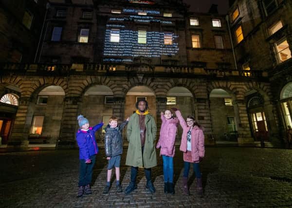 St Margaret's pupils Olivia Liddell, Josie Maxwell (right) with Kayus Bankole at Edinburgh City Chambers and the other winning pupils. Photo by Ian Georgeson.