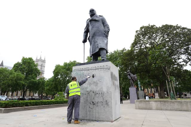 Protesters sprayed graffiti on the statue of Sir Winston Churchill in Westminster (Photo: Aaron Chown)