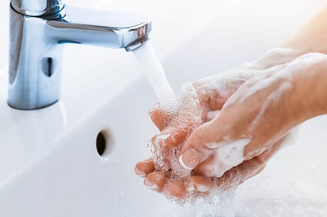 None of the studies revealed a link between mask-wearing and a reduction in hand hygiene. (Shutterstock)