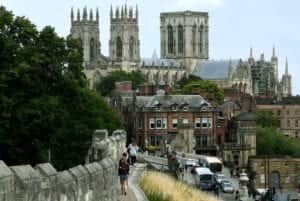 Visitors enjoy a walk along the city walls in York.Picture Jonathan Gawthorpe25th July 2020.